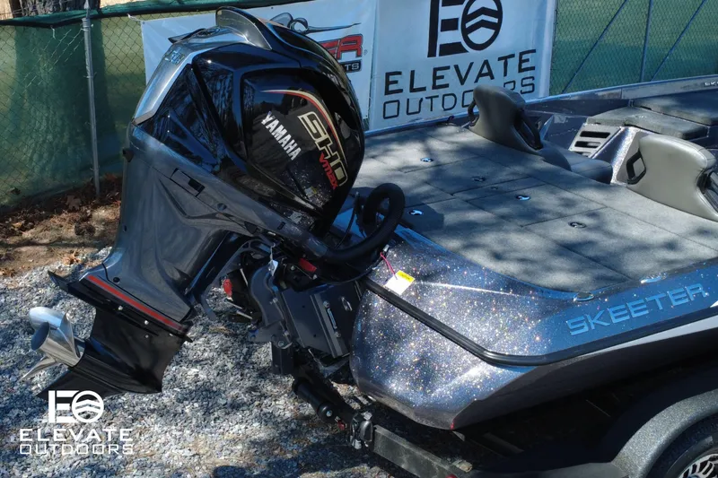 Slide: The Image of Skeeter ZXR 20 SE 2025 boat with Yamaha engine, displayed outdoors. - 11