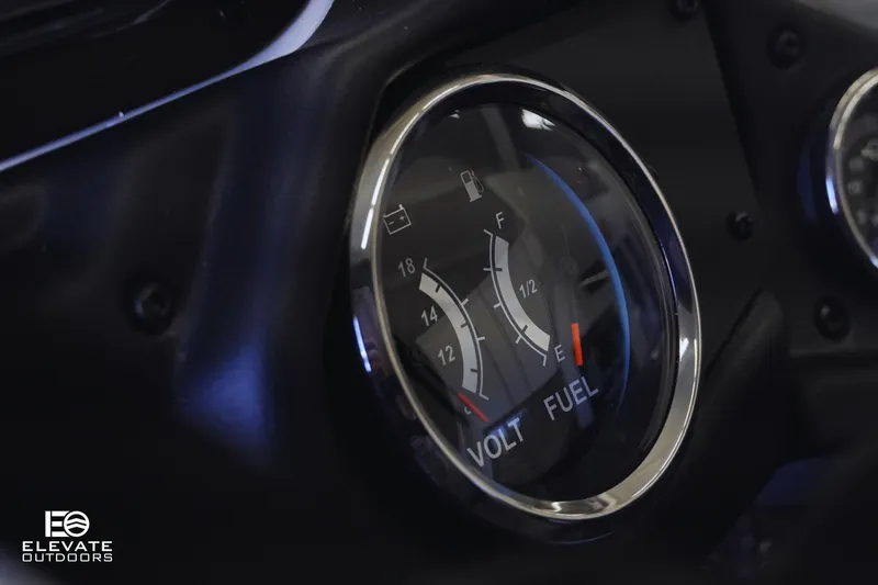 Slide: The Image of Close-up of 2025 Skeeter ZXR 20 SE dashboard showing volt and fuel gauges. - 16