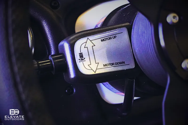 Slide: The Image of Control lever for Skeeter ZXR 20 SE 2025, labeled "Motor Up" and "Motor Down." - 17