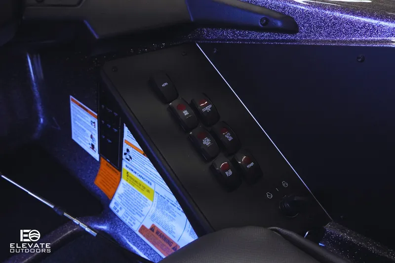 Slide: The Image of Control panel of 2025 Skeeter ZXR 20 SE boat with labeled switches and warning labels. - 18