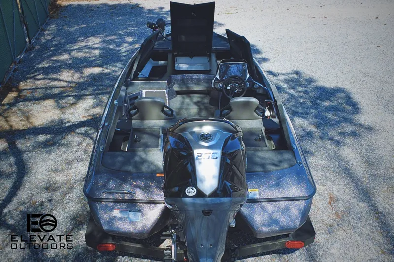 Slide: The Image of 2025 Skeeter ZXR 20 SE boat, top view, parked outdoors, featuring sleek design and modern equipment. - 4