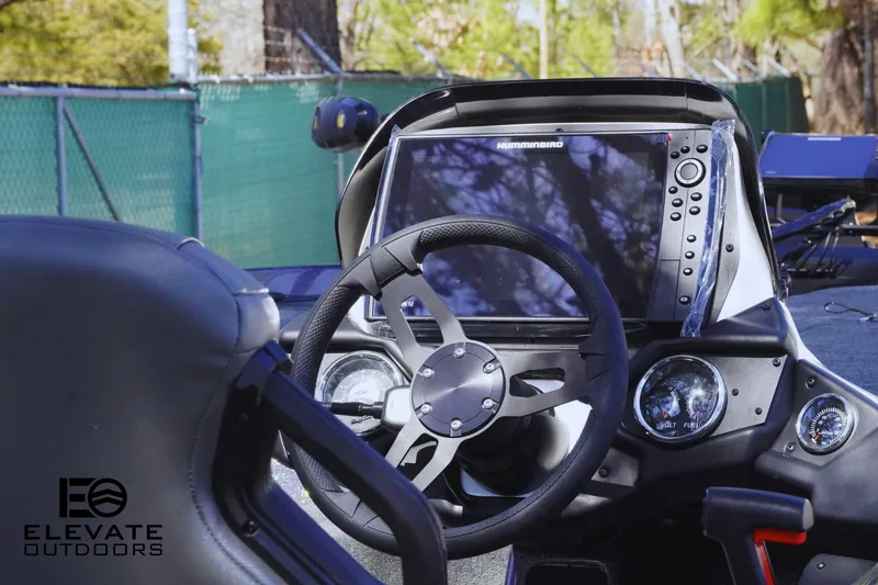 Slide: The Image of 2025 Skeeter ZXR 20 SE boat dashboard with steering wheel and advanced navigation system. - 5