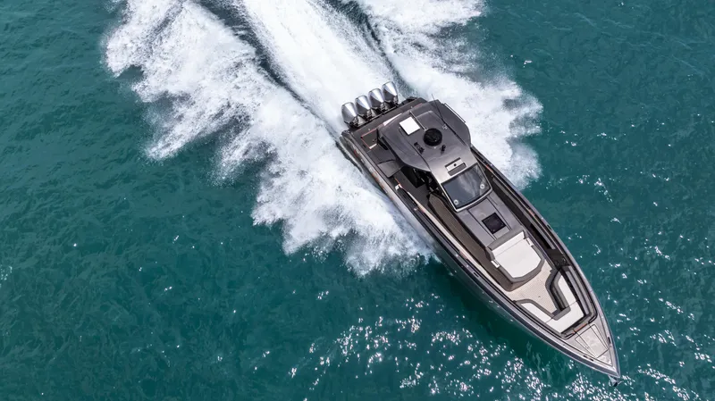 Slide: The Image of Aerial view of 2025 Cigarette 42 Auroris speedboat cruising on turquoise water. - 10