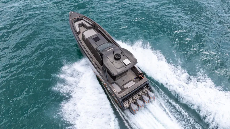 Slide: The Image of 2025 Cigarette 42 Auroris speedboat cruising on open water, aerial view. - 27