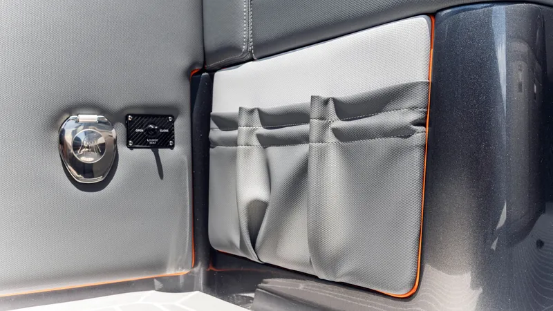 Slide: The Image of Interior detail of 2025 Cigarette 42 Auroris boat, featuring storage pockets and sleek design. - 33