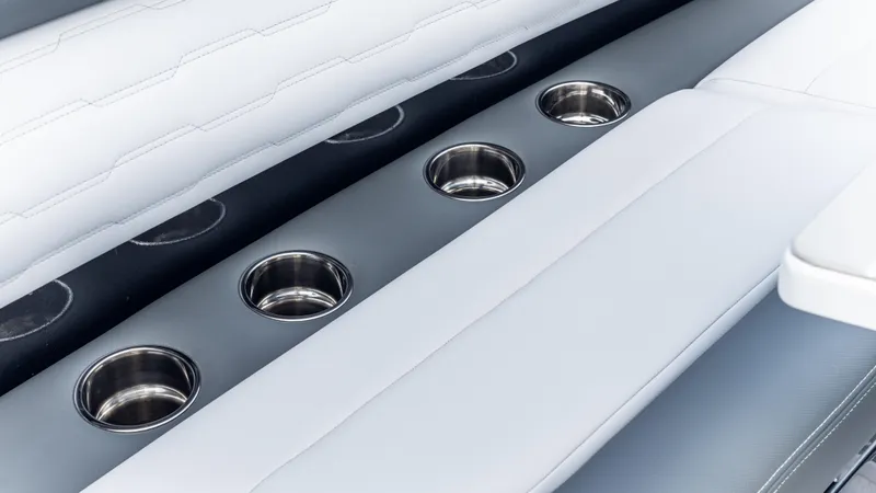 Slide: The Image of Luxury seating with cup holders in 2025 Cigarette 42 Auroris boat interior. - 38