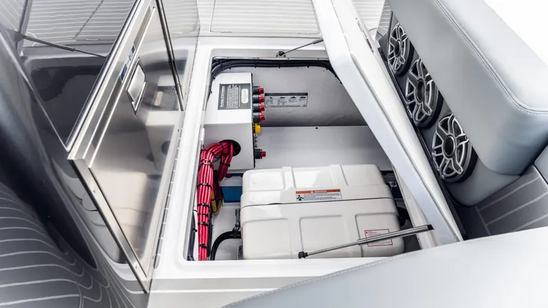 Slide: The Image of 2025 Cigarette 42 Auroris boat interior showing storage compartment and wiring. - 42