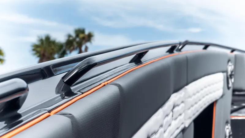 Slide: The Image of 2025 Cigarette 42 Auroris boat interior with sleek design and palm trees in the background. - 43