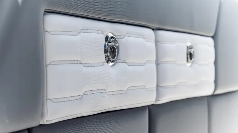 Slide: The Image of Luxury interior detail of 2025 Cigarette 42 Auroris boat, featuring sleek white and gray upholstery. - 45