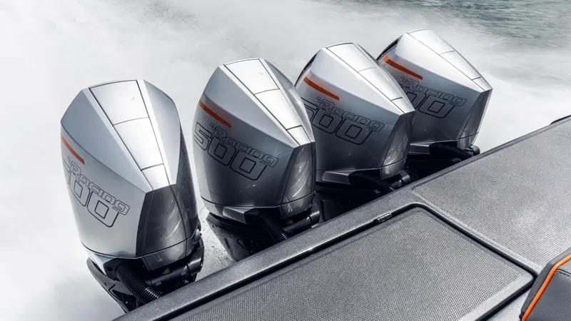 Slide: The Image of Four powerful outboard engines on a 2025 Cigarette 42 Auroris boat. - 48