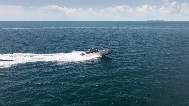 Slide: The Image of 2025 Cigarette 42 Auroris speedboat cruising on open ocean under clear sky. - 9