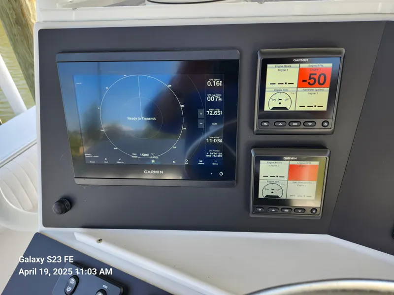 Slide: The Image of Garmin navigation display on 2001 Jupiter 31 Open Center Console boat dashboard. - 12