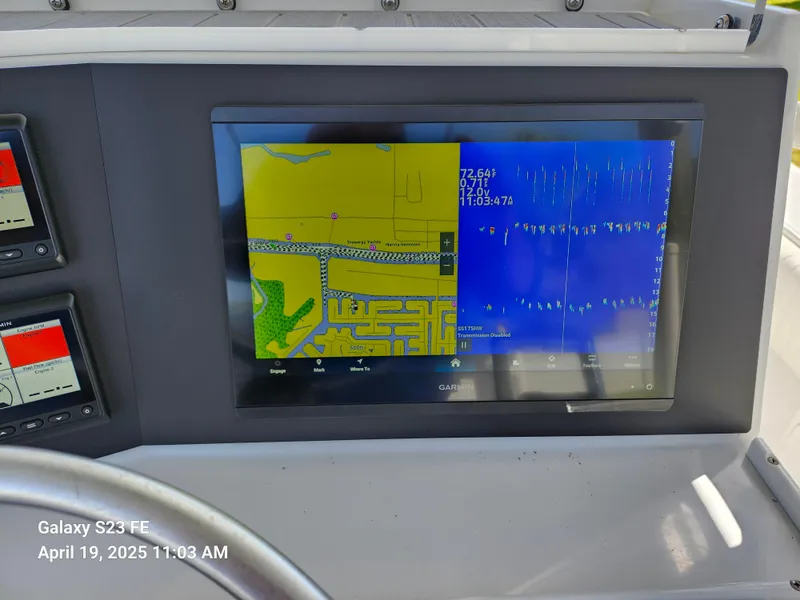 Slide: The Image of Close-up of a navigation display on a 2001 Jupiter 31 Open Center Console boat. - 13