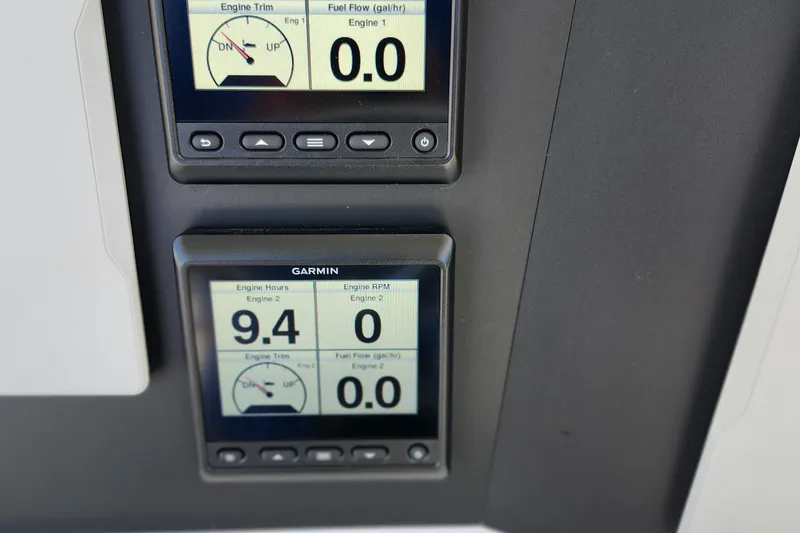 Slide: The Image of Digital displays on a 2001 Jupiter 31 Open Center Console boat dashboard. - 14