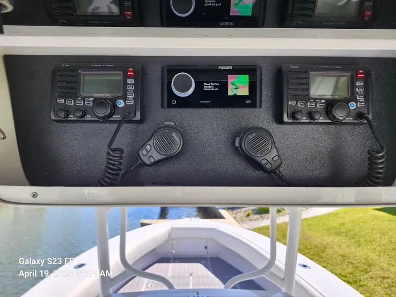 Slide: The Image of Control panel of a 2001 Jupiter 31 Open Center Console boat with communication devices. - 16