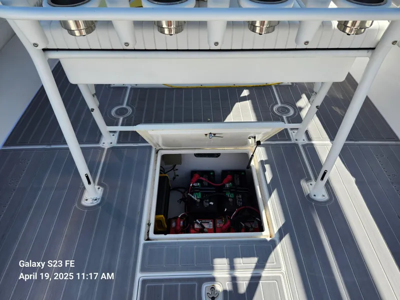 Slide: The Image of 2001 Jupiter 31 Open Center Console boat with open hatch revealing battery compartment. - 26