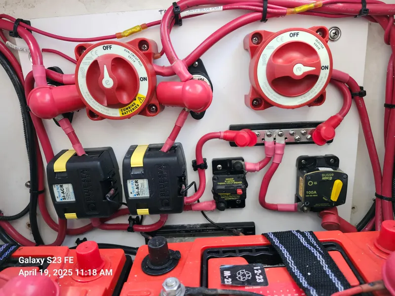 Slide: The Image of Electrical system of a 2001 Jupiter 31 Open Center Console boat with switches and wiring. - 28