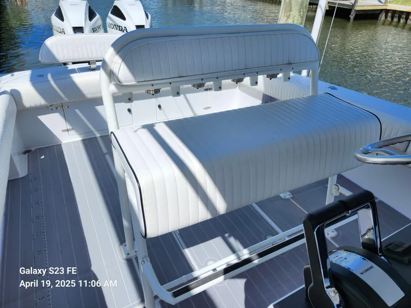 Slide: The Image of 2001 Jupiter 31 Open Center Console boat with Honda engines, docked by the water. - 30