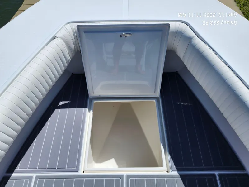 Slide: The Image of Open storage compartment on 2001 Jupiter 31 Open Center Console boat. - 36