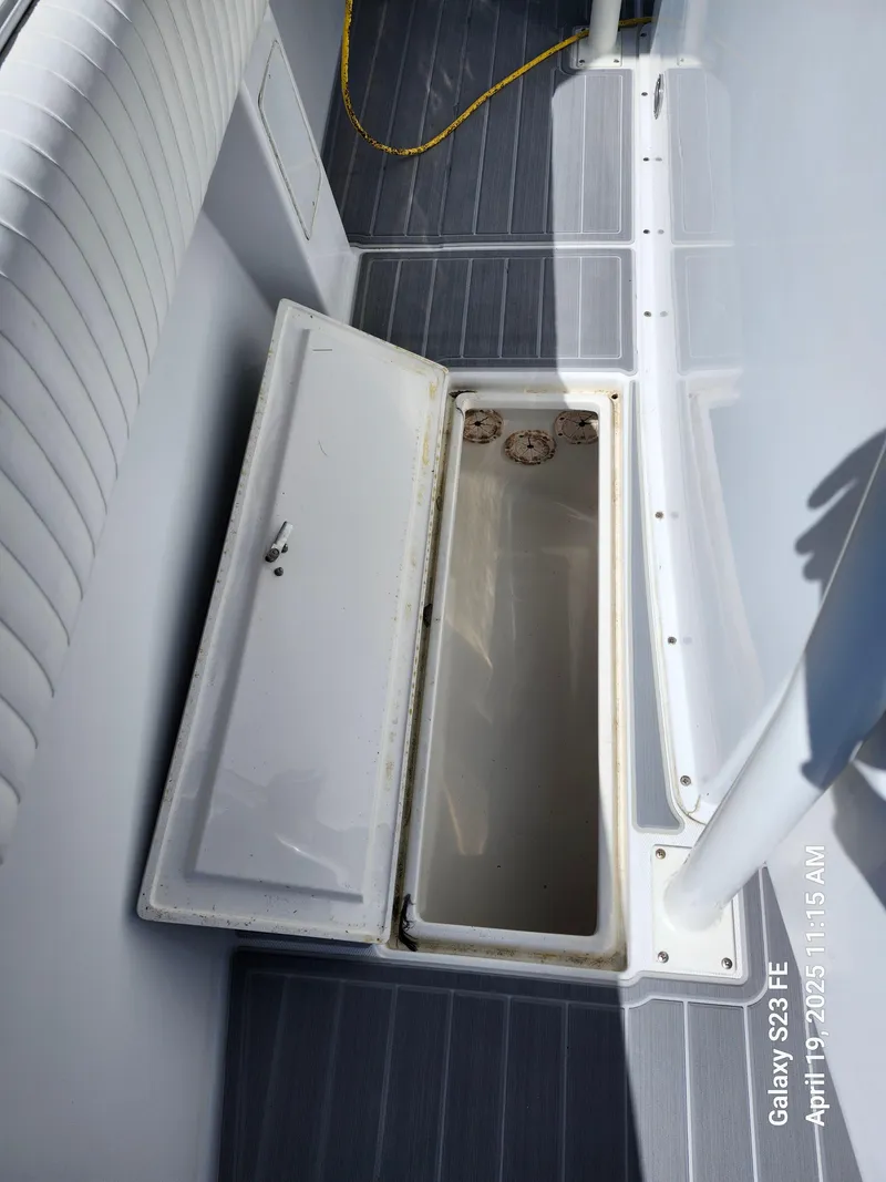 Slide: The Image of Open storage compartment on 2001 Jupiter 31 Open Center Console boat. - 37