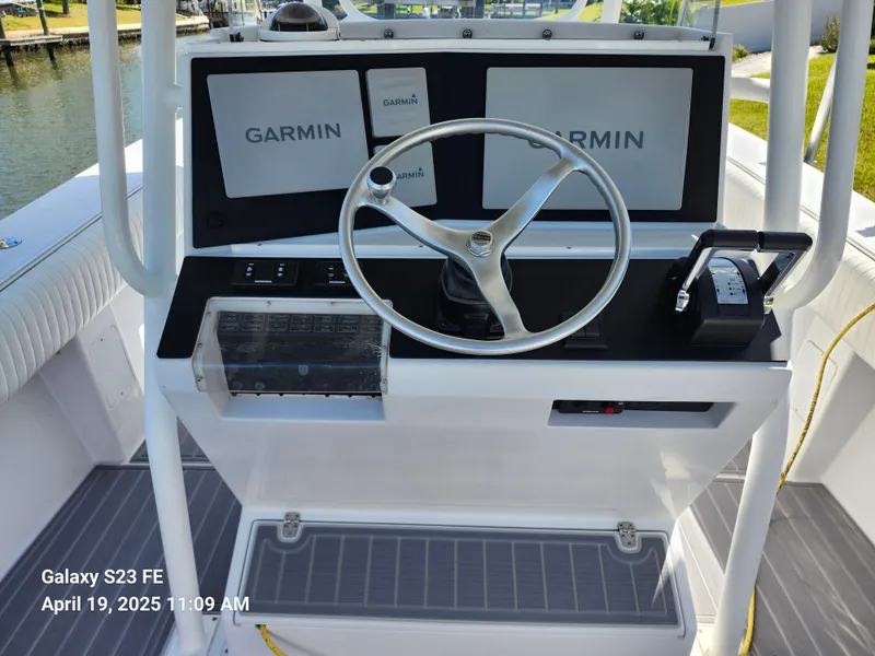 Slide: The Image of Center console of 2001 Jupiter 31 Open boat with Garmin navigation system. - 8