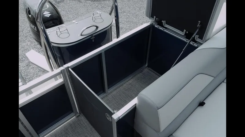 Slide: The Image of 2025 Tahoe Pontoon Sport 85 Cruise interior with seating and storage compartments. - 13