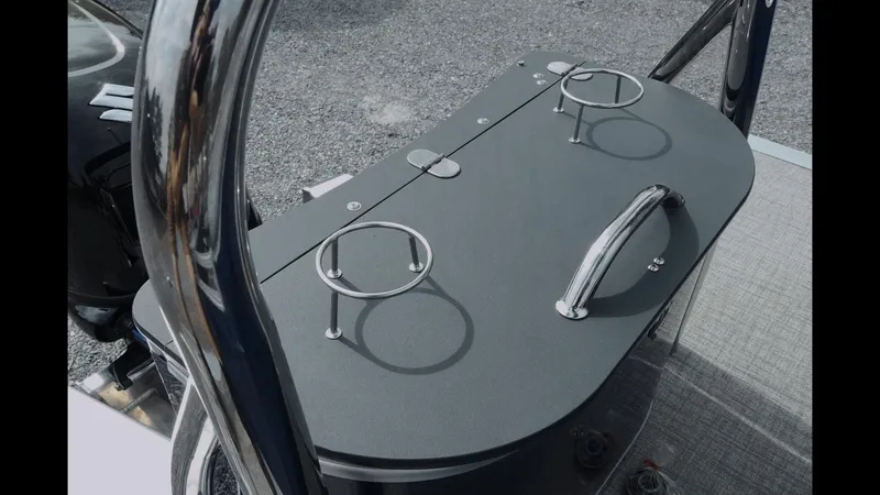 Slide: The Image of 2025 Tahoe Pontoon Sport 85 Cruise deck with cup holders and handle. - 14