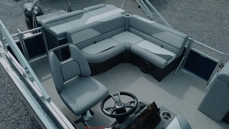 Slide: The Image of 2025 Tahoe Pontoon Sport 85 Cruise interior with modern seating and steering wheel. - 2