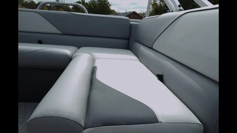 Slide: The Image of 2025 Tahoe Pontoon Sport 85 Cruise interior seating, featuring sleek gray and white upholstery. - 20