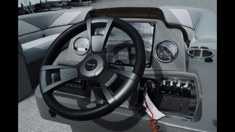 Slide: The Image of 2025 Tahoe Pontoon Sport 85 Cruise steering console with modern controls and sleek design. - 3