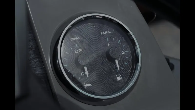 Slide: The Image of Dashboard gauge of 2025 Tahoe Pontoon Sport 85 Cruise, showing trim and fuel levels. - 5