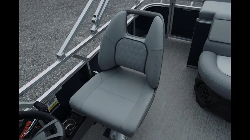 Slide: The Image of 2025 Tahoe Pontoon Sport 85 Cruise, featuring a sleek gray captain's chair and modern interior design. - 8