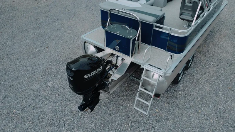 Slide: The Image of 2025 Tahoe Pontoon Sport 85 Cruise with Suzuki outboard motor, rear view. - 9