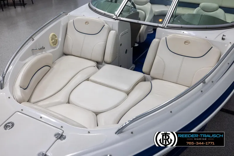 Slide: The Image of 2006 Crownline 230 LS boat interior with white leather seating and sleek design. - 10
