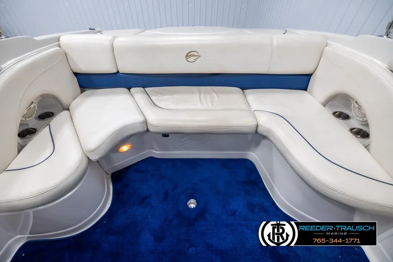 Slide: The Image of 2006 Crownline 230 LS boat interior with white seating and blue carpet. - 18