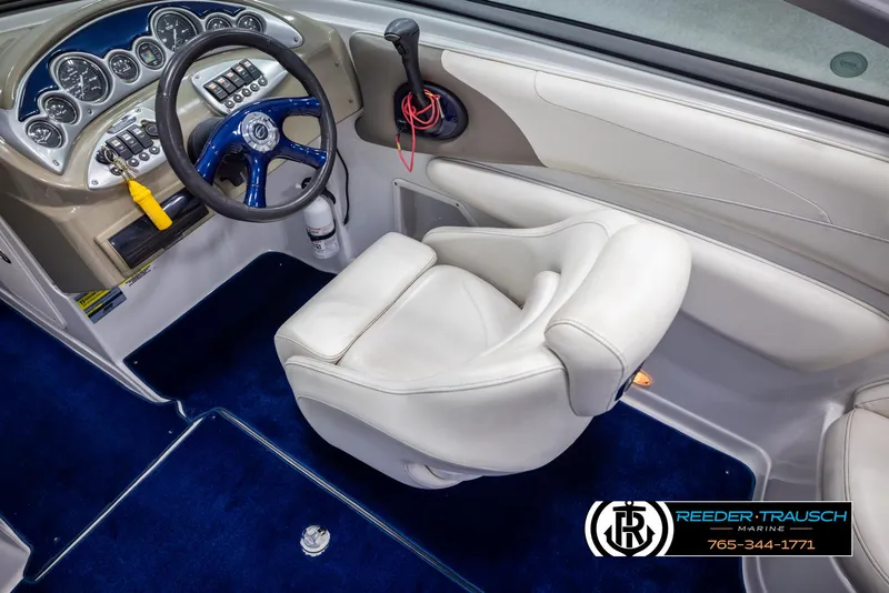 Slide: The Image of Interior of a 2006 Crownline 230 LS boat with steering wheel and dashboard. - 22