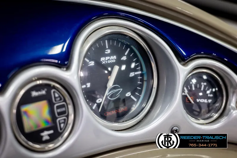 Slide: The Image of Dashboard of a 2006 Crownline 230 LS boat with RPM and voltage gauges. - 31