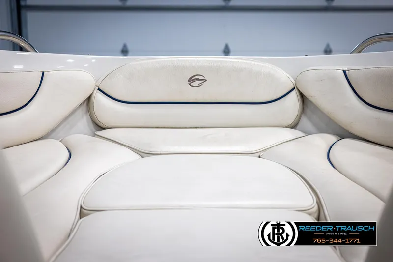 Slide: The Image of 2006 Crownline 230 LS boat interior with white cushioned seating. - 37