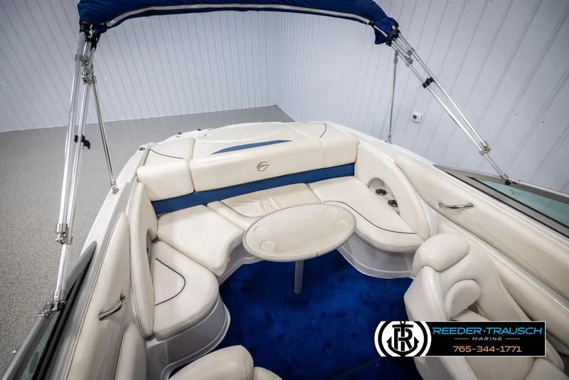 Slide: The Image of 2006 Crownline 230 LS boat interior with white seating and blue carpet. - 45