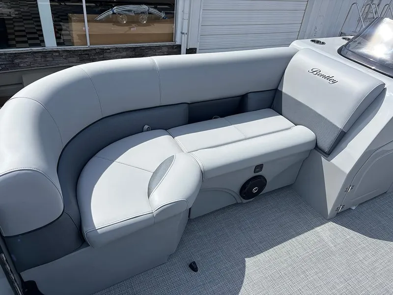 Slide: The Image of 2025 Bentley Pontoons Legacy QSB interior with luxurious gray seating and modern design. - 13