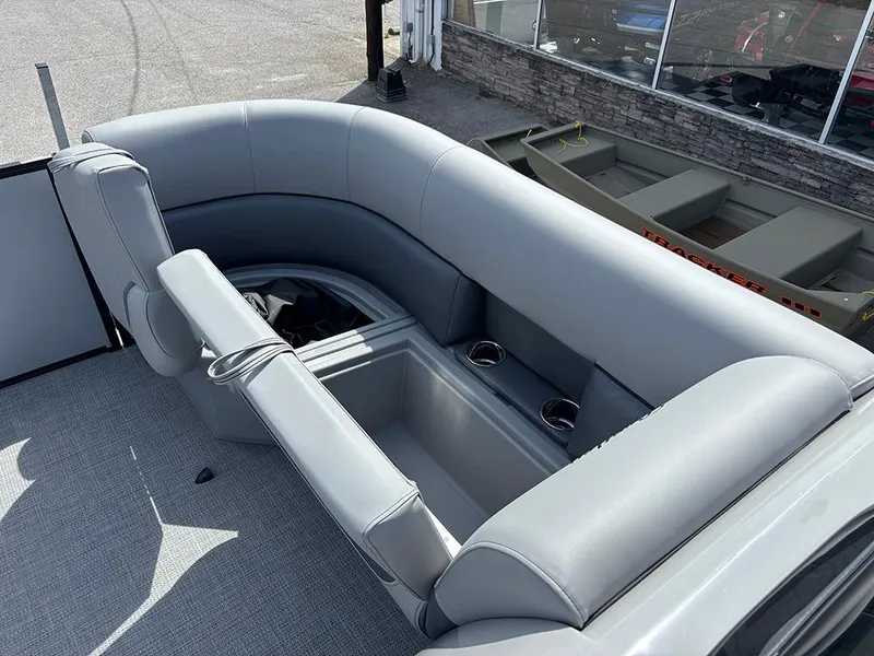 Slide: The Image of 2025 Bentley Pontoons Legacy QSB with luxurious gray seating and cup holders. - 14