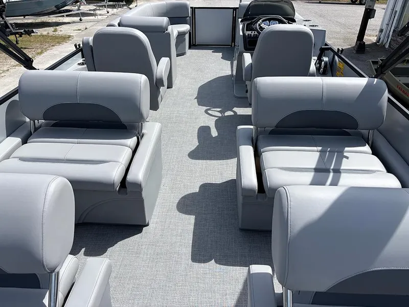 Slide: The Image of 2025 Bentley Pontoons Legacy QSB interior with luxurious gray seating and spacious layout. - 18