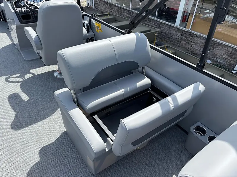 Slide: The Image of 2025 Bentley Pontoons Legacy QSB interior with gray seating and storage compartment. - 19