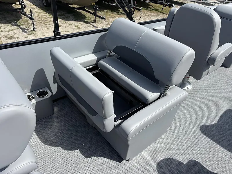 Slide: The Image of 2025 Bentley Pontoons Legacy QSB interior with gray seating and storage compartment. - 20