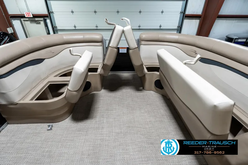 Slide: The Image of Interior of 2018 Bennington 20 SLMX pontoon boat with beige seating and carpet. - 23