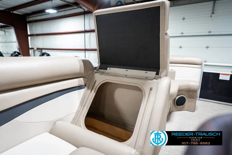 Slide: The Image of 2018 Bennington 20 SLMX boat interior storage compartment open in showroom. - 25