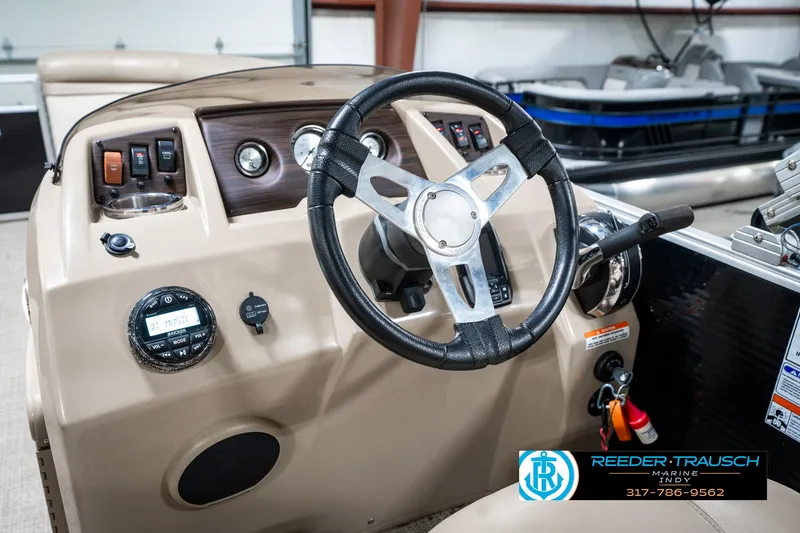 Slide: The Image of 2018 Bennington 20 SLMX boat dashboard with steering wheel and controls. - 32