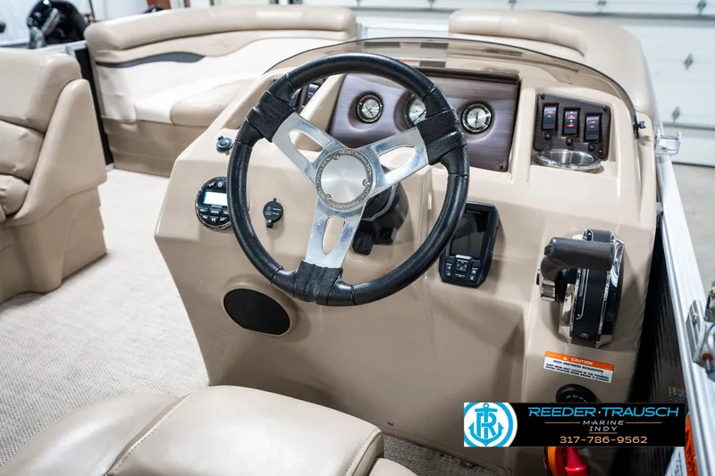 Slide: The Image of 2018 Bennington 20 SLMX boat interior with steering wheel and control panel. - 33
