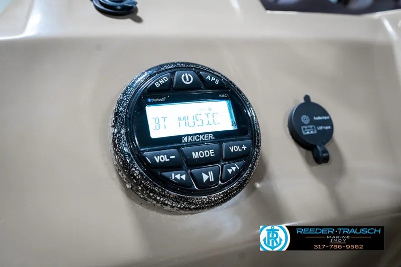 Slide: The Image of Kicker audio system on 2018 Bennington 20 SLMX boat dashboard, displaying "BT MUSIC." - 35