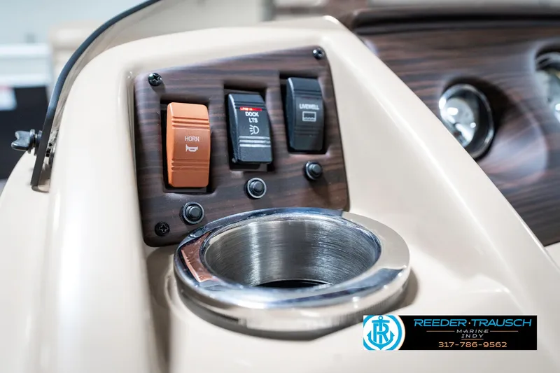Slide: The Image of Control panel of 2018 Bennington 20 SLMX boat with cup holder and switches. - 36